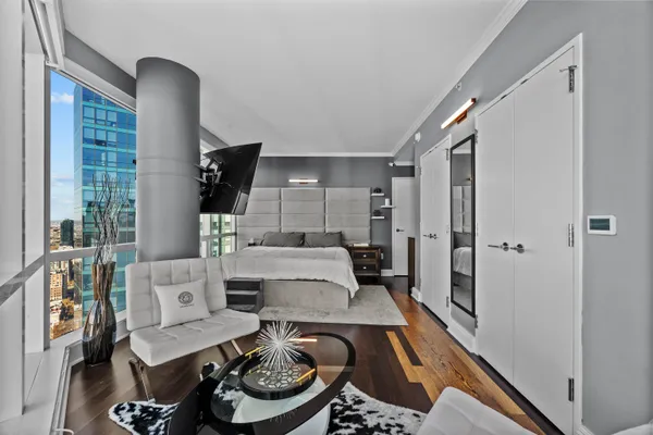 a living room with furniture and a rug