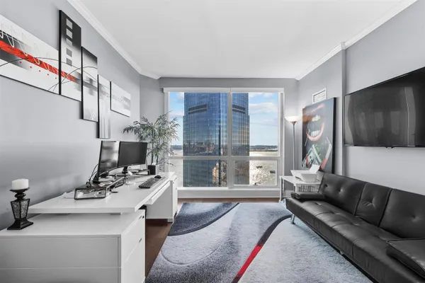 a living room with furniture and a flat screen tv