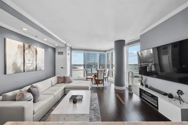 a living room with furniture and a flat screen tv