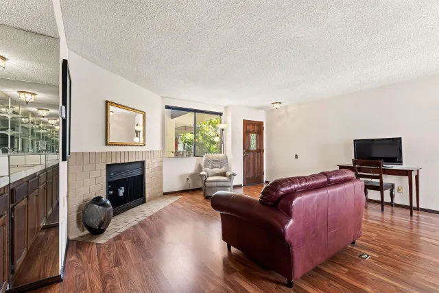 a living room with furniture and a fireplace