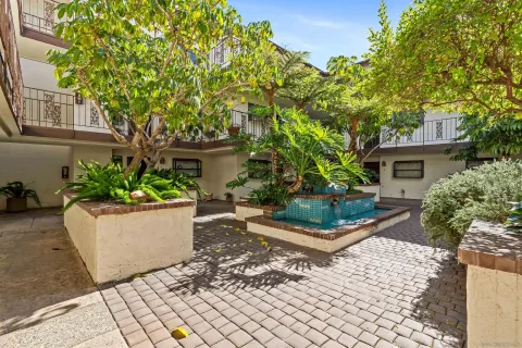 front view of a house with a garden