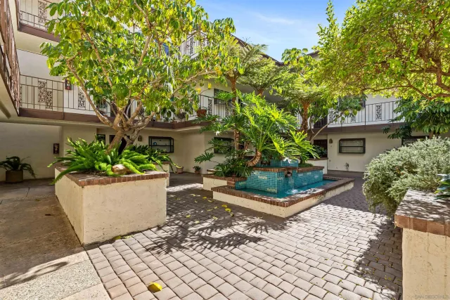 front view of a house with a garden