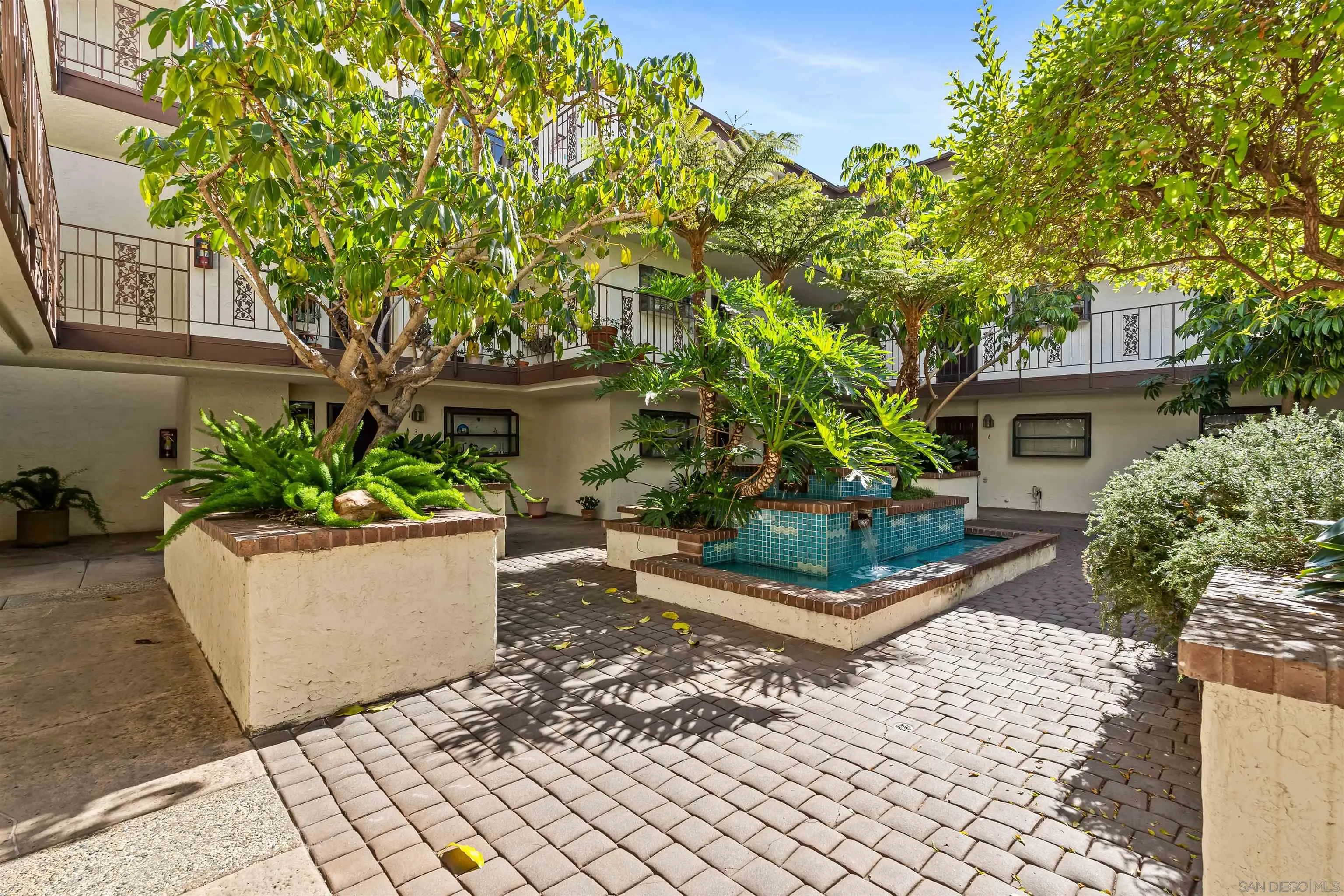 1263 Robinson Avenue, Unit 13 San Diego, CA 92103 - Photo 28 of 40 front view of a house with a garden