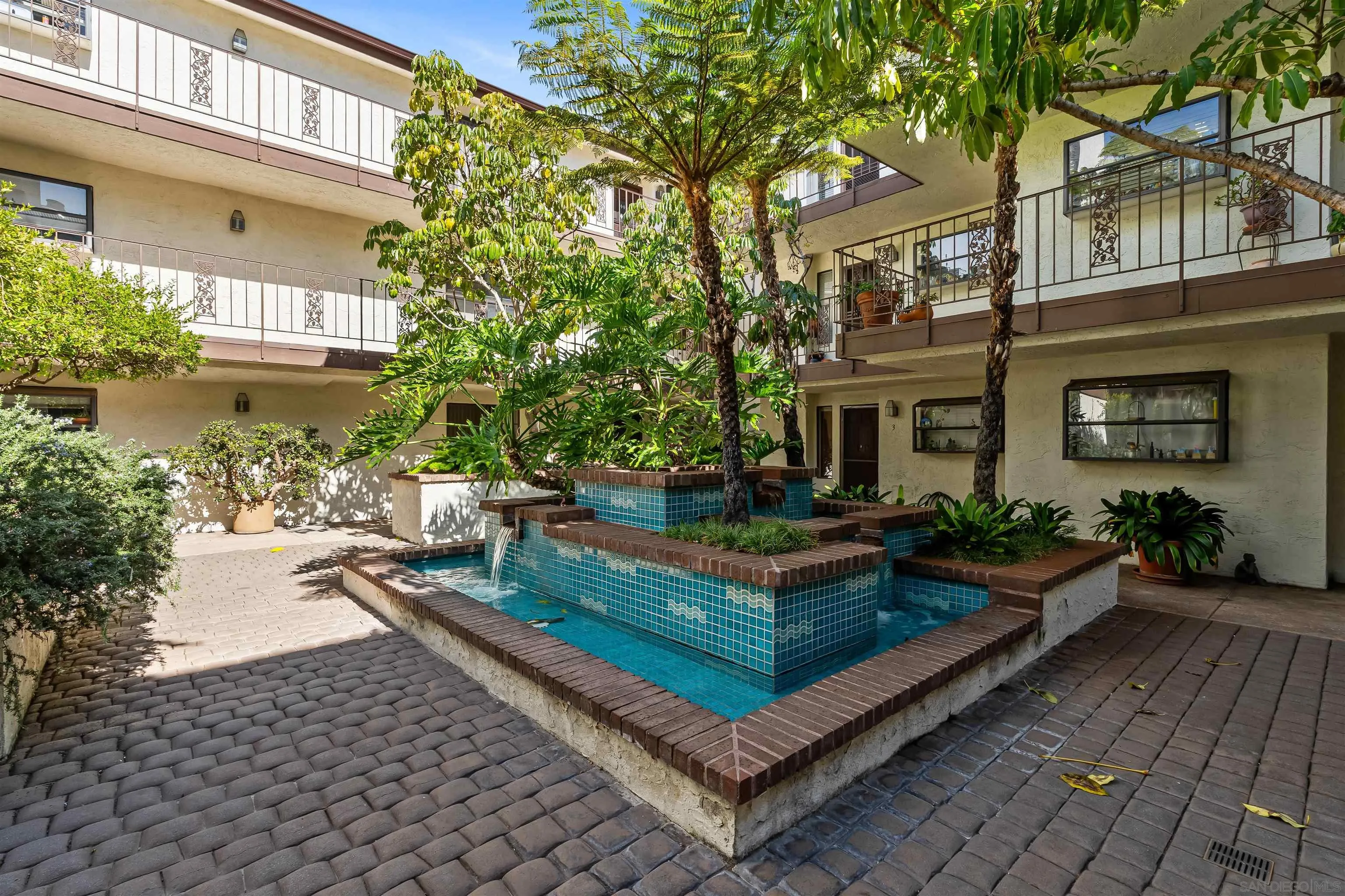 1263 Robinson Avenue, Unit 13 San Diego, CA 92103 - Photo 29 of 40 a view of a house with backyard sitting area and garden