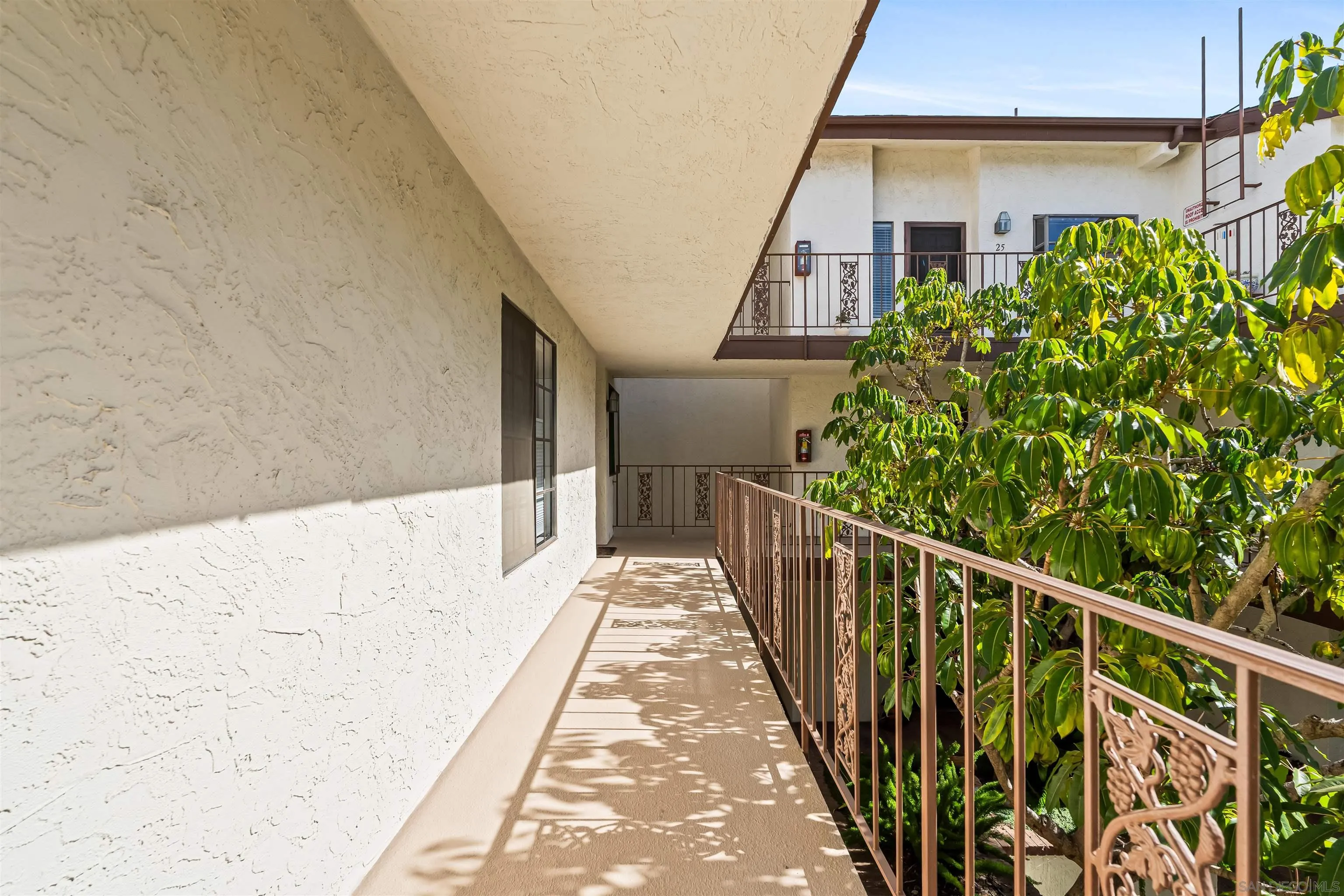 1263 Robinson Avenue, Unit 13 San Diego, CA 92103 - Photo 35 of 40 a view of a balcony with wooden floor