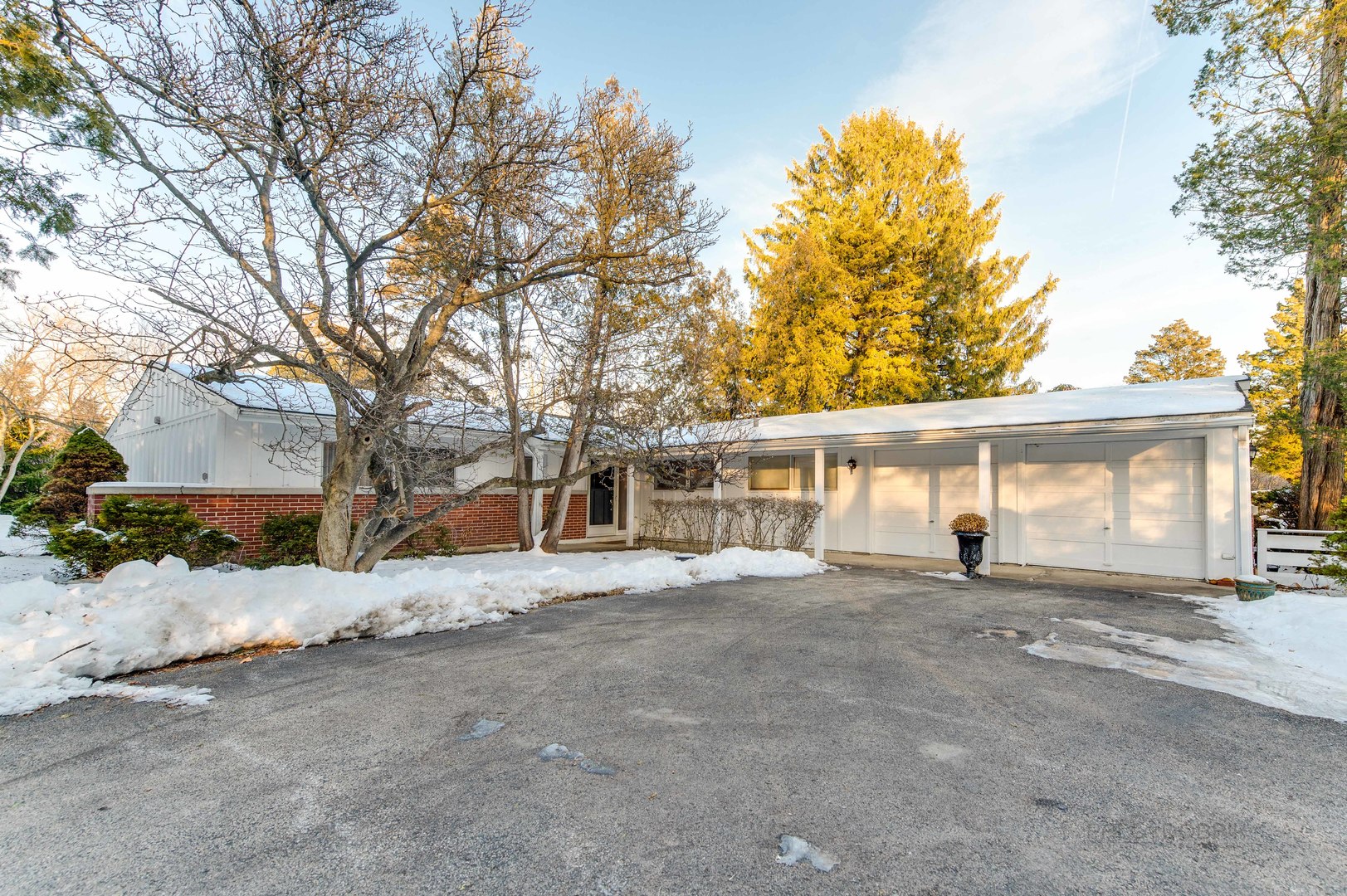 780 West Deerpath Road Lake Forest, IL 60045 - Photo 2 of 35 a view of a house with a yard covered in snow