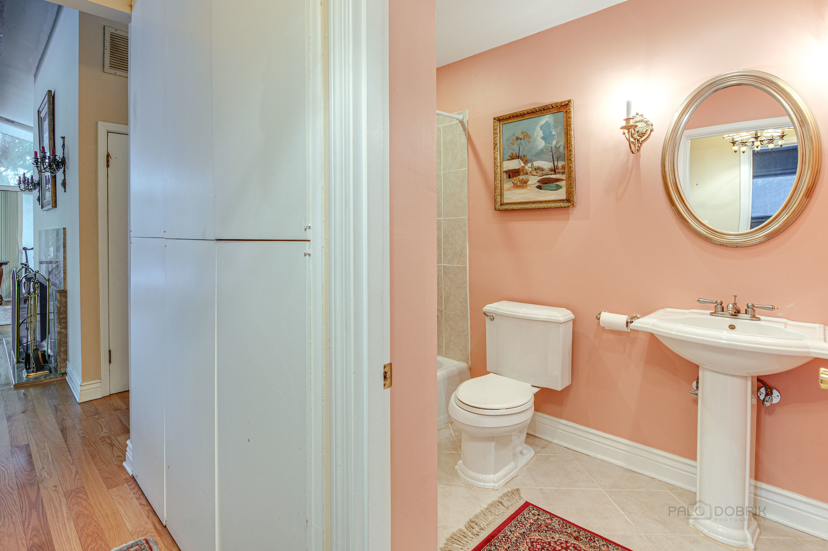 780 West Deerpath Road Lake Forest, IL 60045 - Photo 21 of 35 a bathroom with a toilet a sink and a mirror