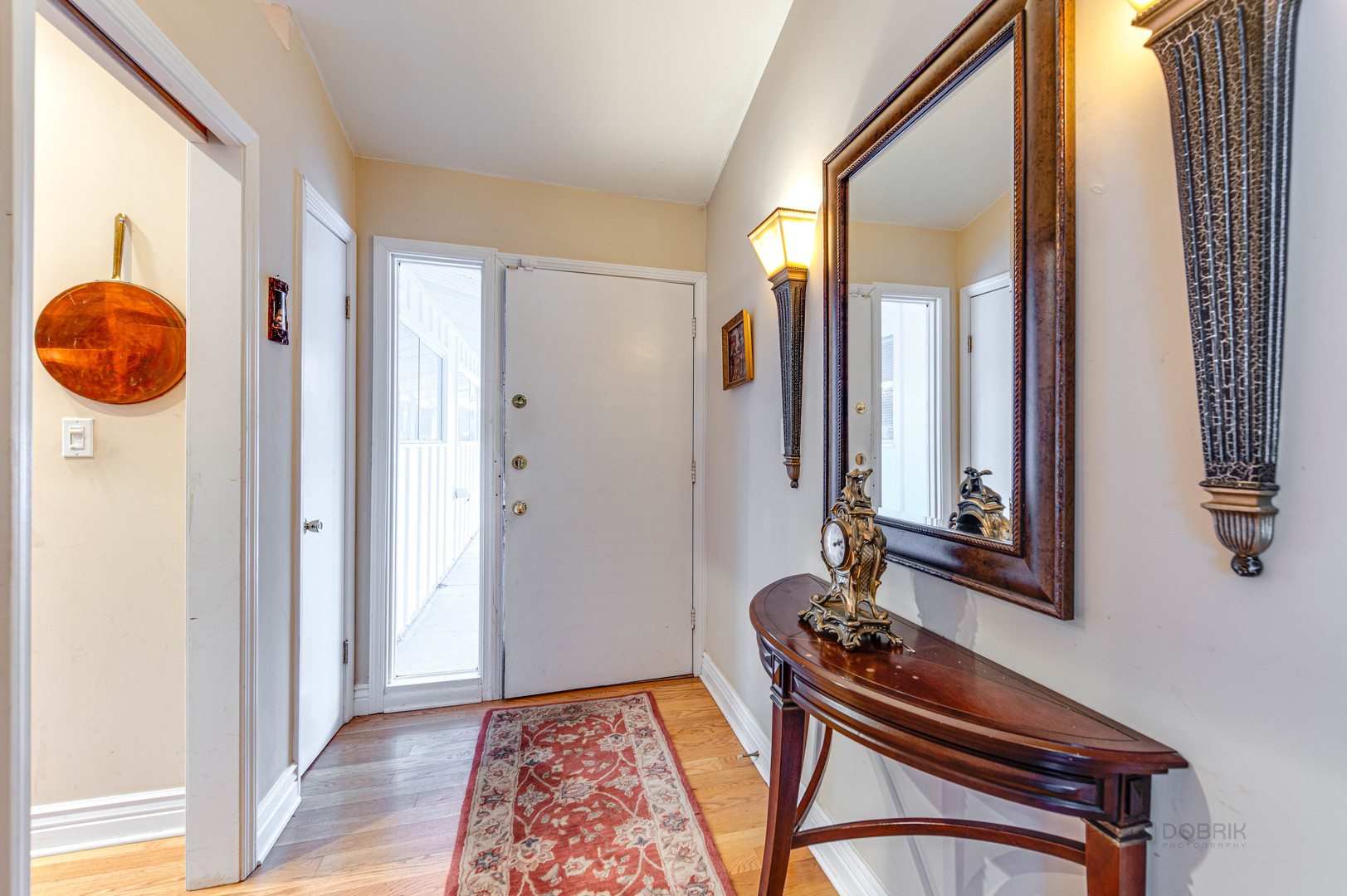 780 West Deerpath Road Lake Forest, IL 60045 - Photo 4 of 35 a view of an entryway with a mirror and a window