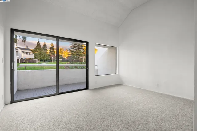 an empty room with large window