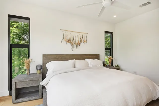 a view of house with swimming pool and outdoor seating