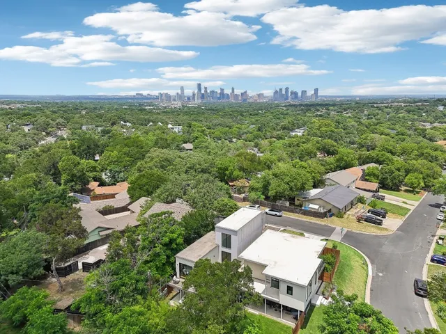 a view of a hallway with wooden shelves