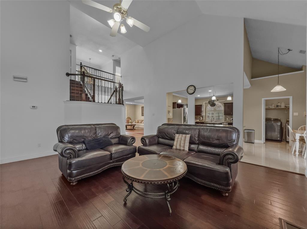 2317 Wellesly Road Rowlett, TX 75089 - Photo 10 of 39 a living room with furniture and a wooden floor