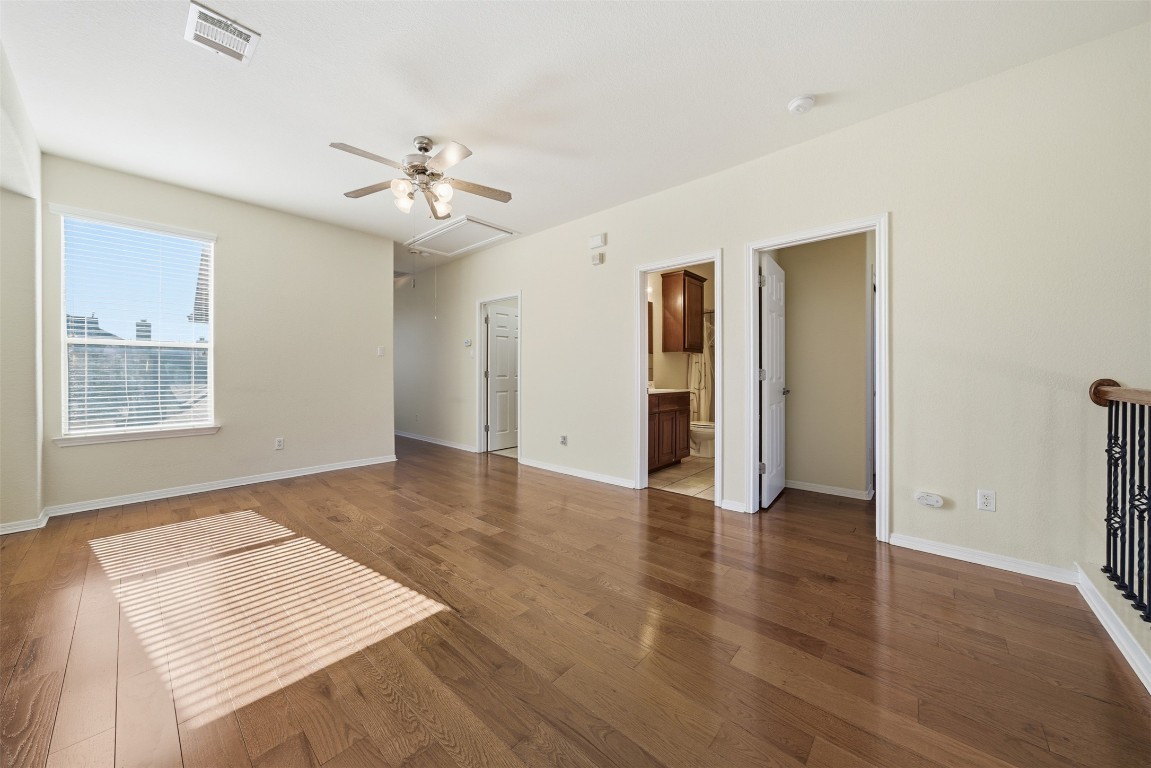 14100 Avery Ranch Boulevard, Unit 1502 Austin, TX 78717 - Photo 17 of 39 Unfurnished living room with hardwood / wood-style floors and ceiling fan