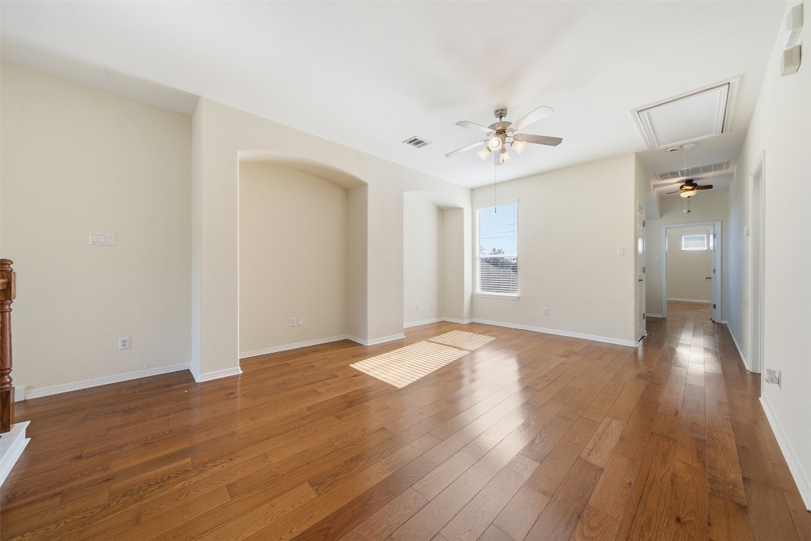 14100 Avery Ranch Boulevard, Unit 1502 Austin, TX 78717 - Photo 18 of 39 wooden floor in an empty room with a window