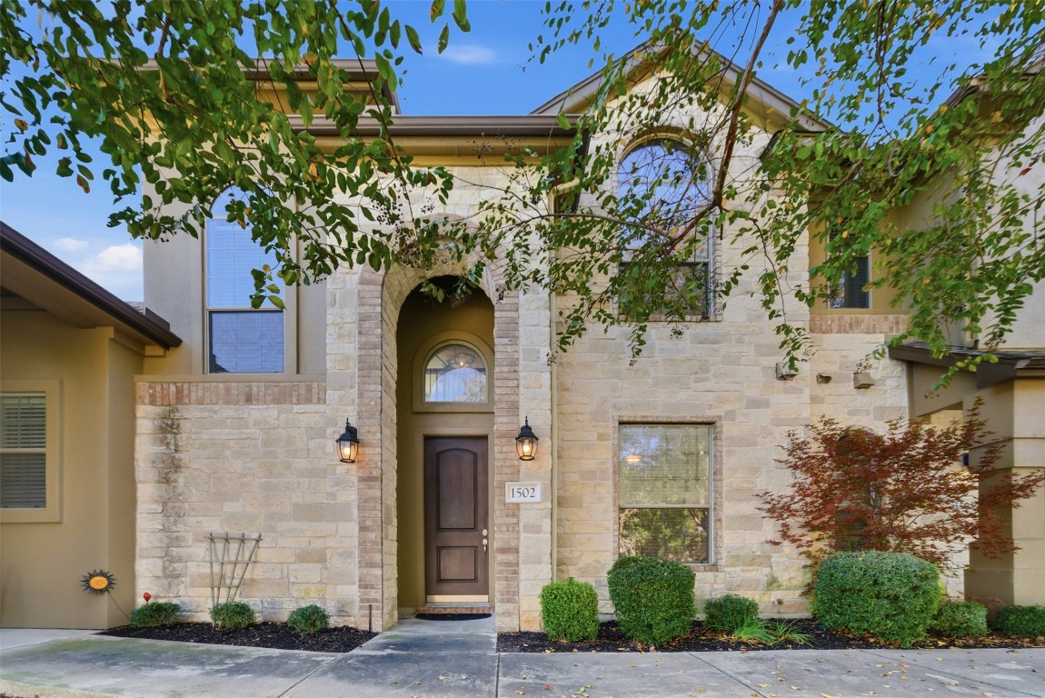 14100 Avery Ranch Boulevard, Unit 1502 Austin, TX 78717 - Photo 2 of 39 Doorway to property featuring stone siding