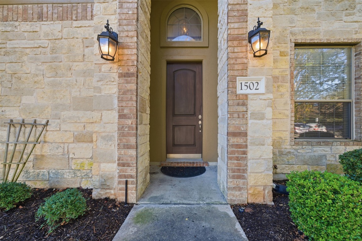 14100 Avery Ranch Boulevard, Unit 1502 Austin, TX 78717 - Photo 3 of 39 Entrance to property featuring stone siding