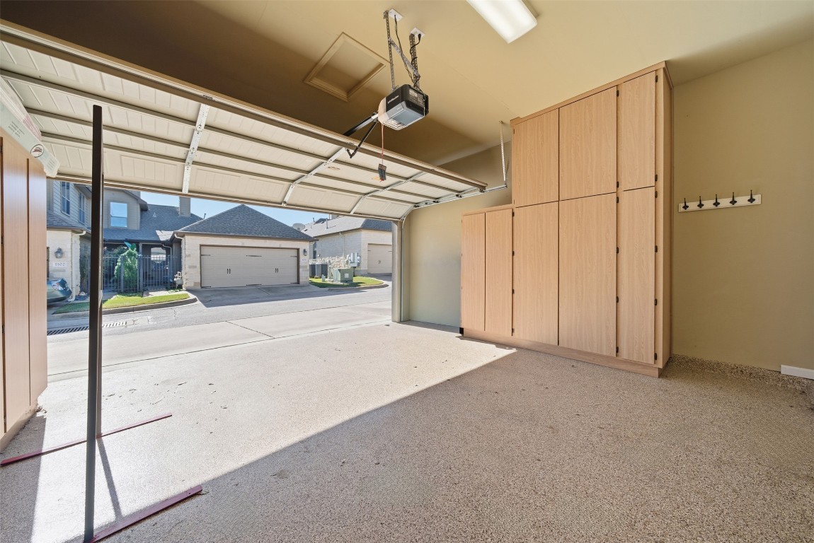 14100 Avery Ranch Boulevard, Unit 1502 Austin, TX 78717 - Photo 35 of 39 Garage featuring a garage door opener