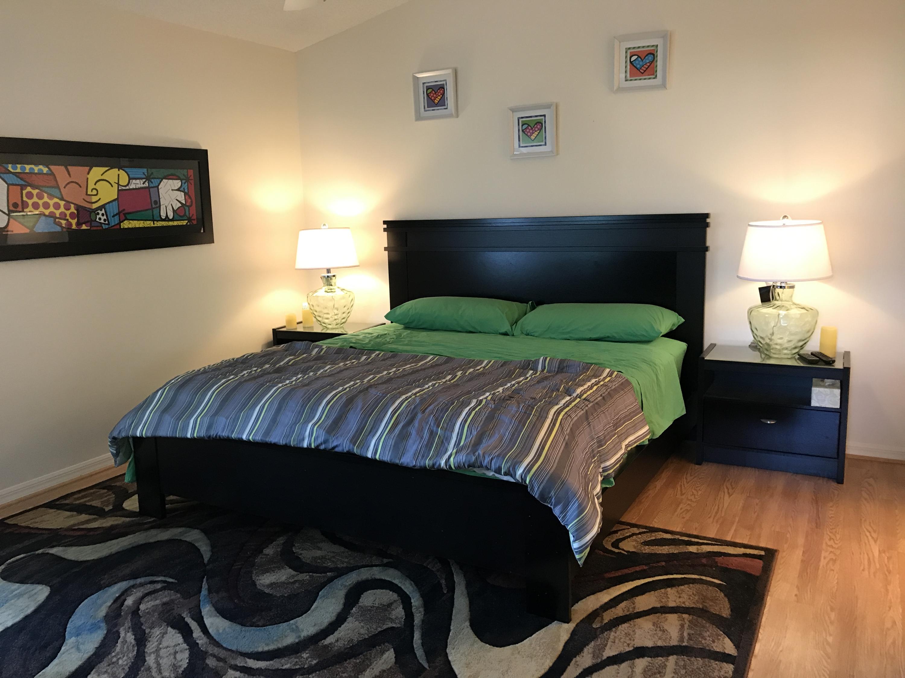 15290 Lake Wildflower Road Delray Beach, FL 33484 - Photo 7 of 22 a bedroom with a bed and dresser