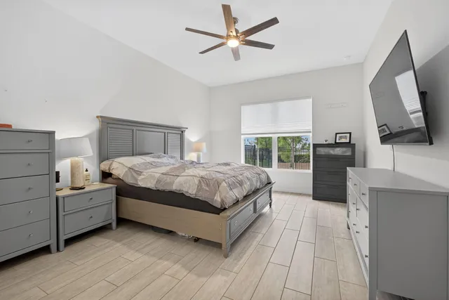 a bathroom with a double vanity sink mirror and shower