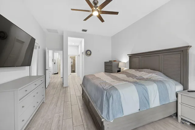 a view of a workspace with furniture and a flat screen tv