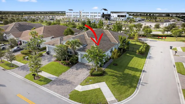 an aerial view of a house with a lake view