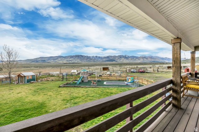 3054 West Ridgeline Road Stockton, UT 84071 - Photo 6 of 88 Deck with a mountain view and an outbuilding