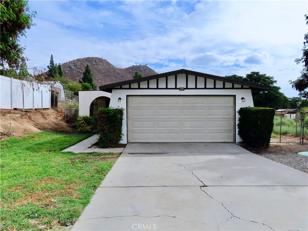 6149 La Sierra Avenue Riverside, CA 92505 - Photo 1 of 37 a front view of a house with a yard