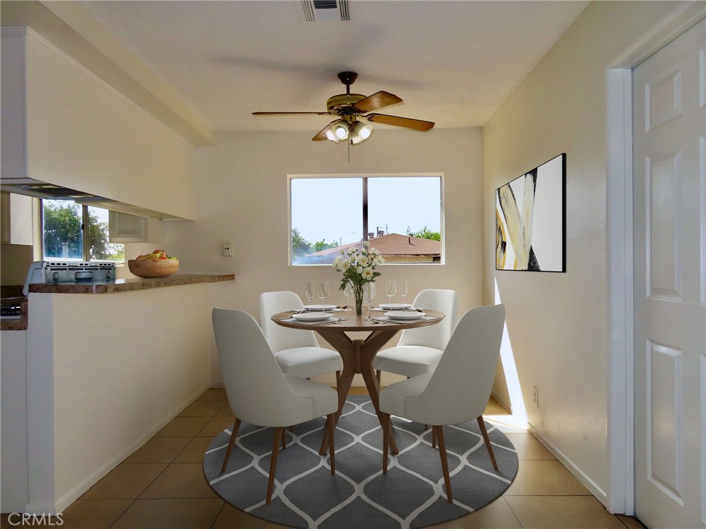 6149 La Sierra Avenue Riverside, CA 92505 - Photo 11 of 37 a view of a dining room with furniture and a chandelier fan