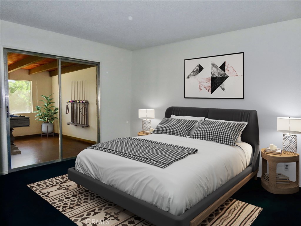 6149 La Sierra Avenue Riverside, CA 92505 - Photo 18 of 37 a bedroom with a large bed and a rug