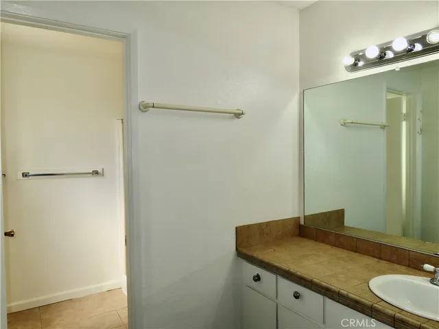 an empty room with a ceiling fan and a window