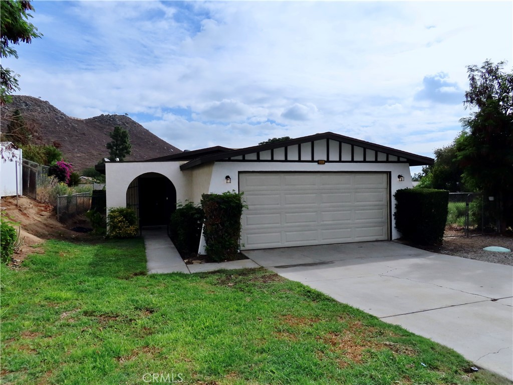 6149 La Sierra Avenue Riverside, CA 92505 - Photo 2 of 37 a front view of a house with garden