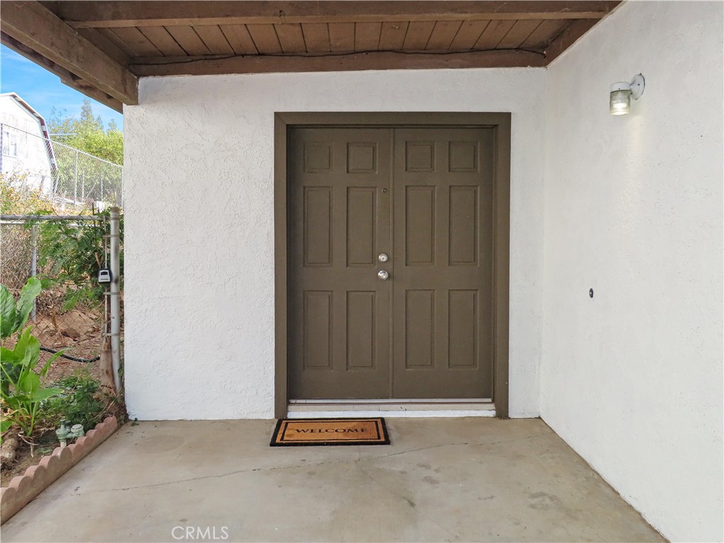 6149 La Sierra Avenue Riverside, CA 92505 - Photo 6 of 37 an empty room with wooden floor and windows