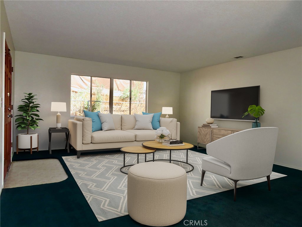 6149 La Sierra Avenue Riverside, CA 92505 - Photo 7 of 37 a living room with furniture a flat screen tv and a large window