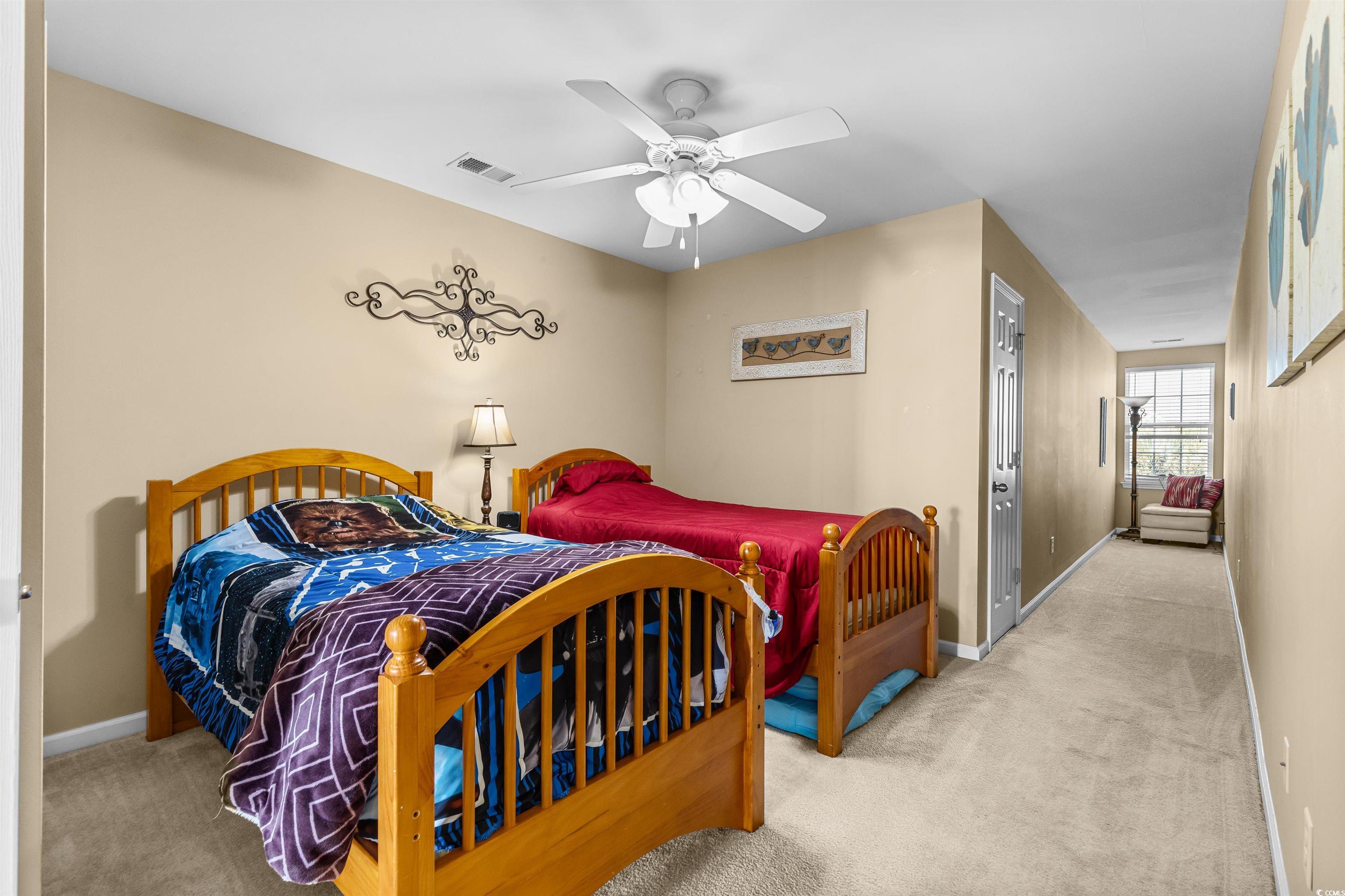 3233 Volterra Way, Unit 3233 Myrtle Beach, SC 29579 - Photo 25 of 40 Carpeted bedroom with baseboards and a ceiling fan