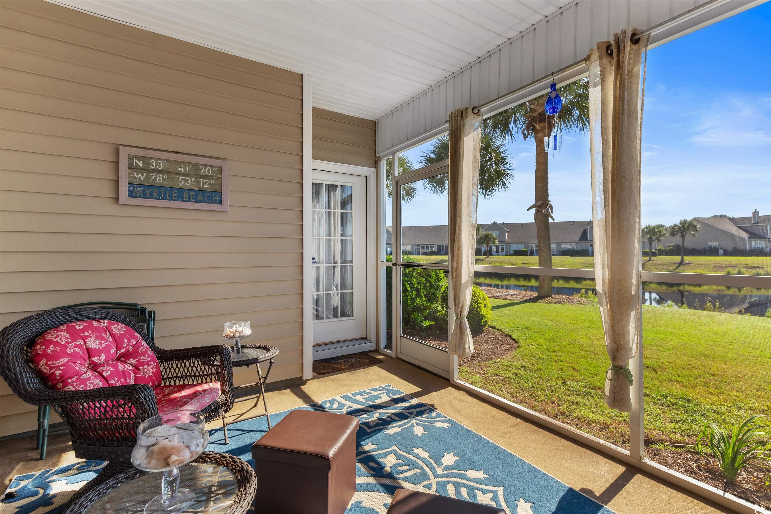 3233 Volterra Way, Unit 3233 Myrtle Beach, SC 29579 - Photo 33 of 40 Sunroom / solarium featuring a residential view and a water view