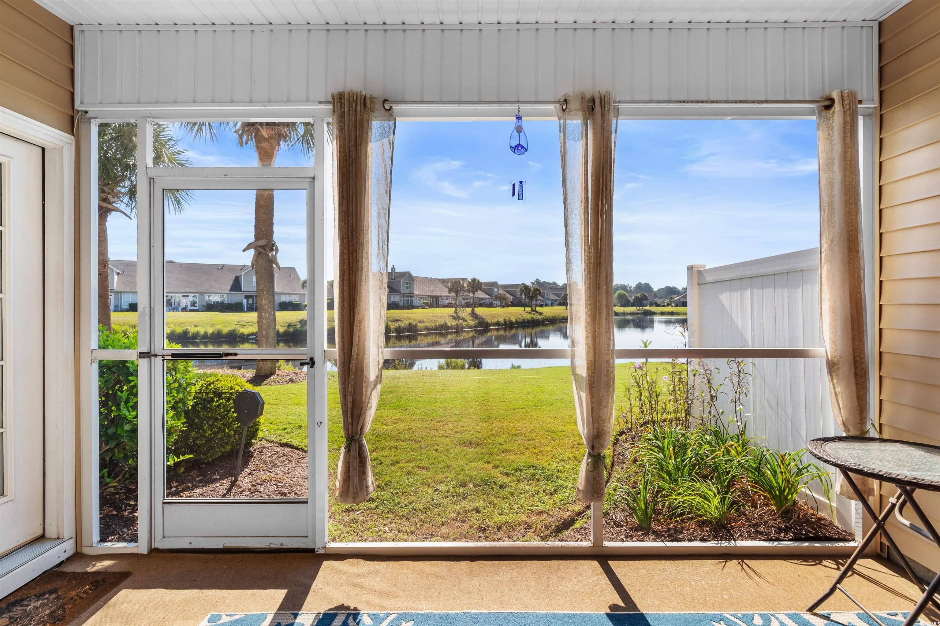 3233 Volterra Way, Unit 3233 Myrtle Beach, SC 29579 - Photo 34 of 40 Unfurnished sunroom with healthy amount of natural light, a water view, and a residential view