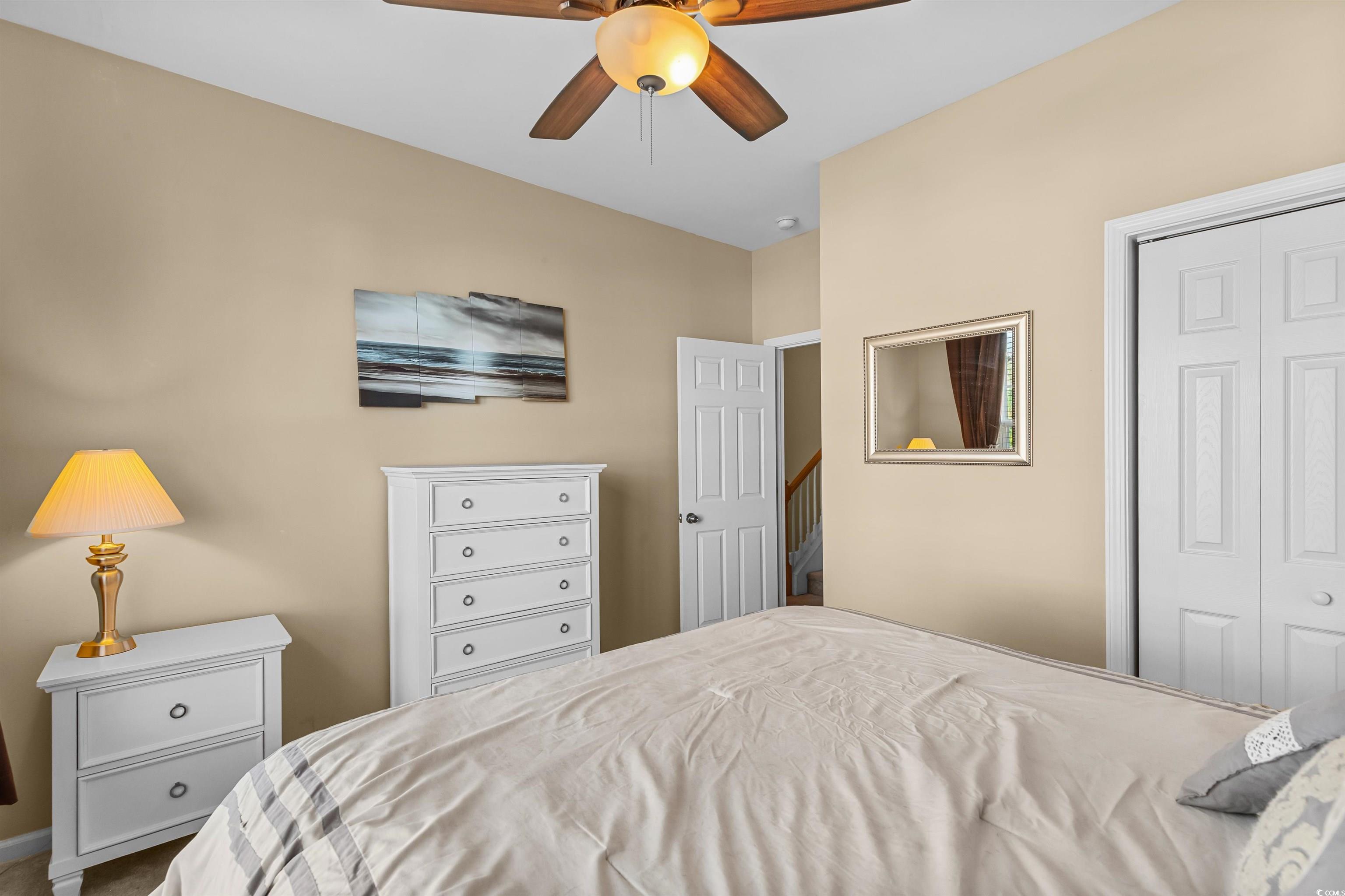 3233 Volterra Way, Unit 3233 Myrtle Beach, SC 29579 - Photo 7 of 40 Bedroom with a closet and a ceiling fan