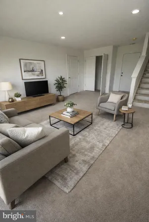 a living room with furniture and a rug