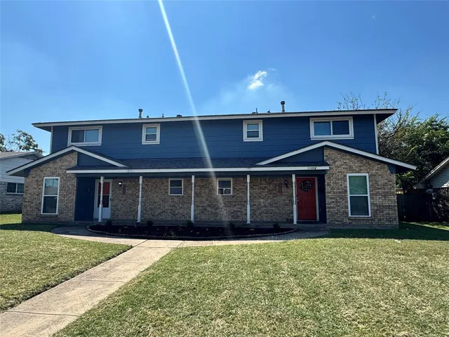 front view of a house with a yard