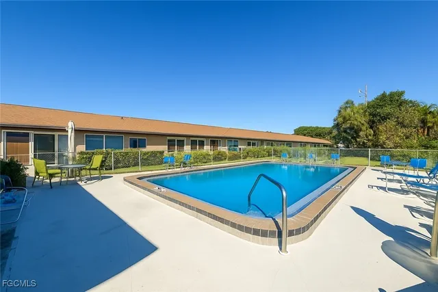 a view of a swimming pool with lounge chair