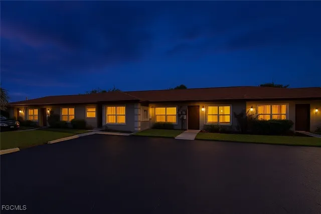 a view of house with yard and green space