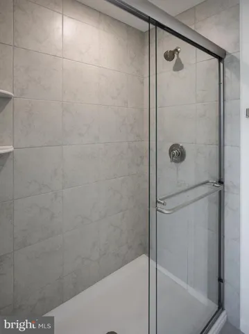 a picture of a bathroom with mirror gate