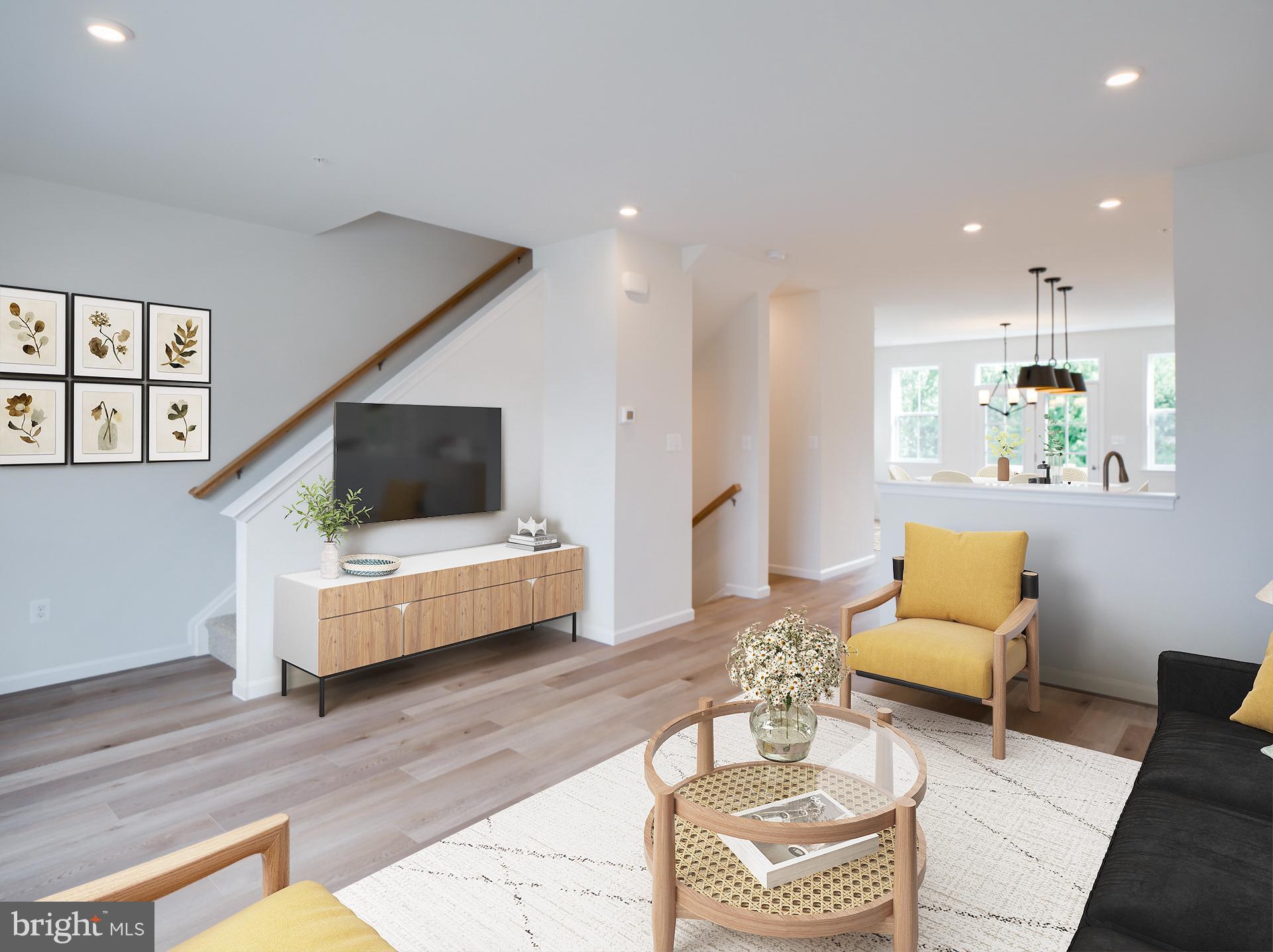 2603 Front Shed Drive Frederick, MD 21702 - Photo 4 of 77 a living room with furniture and a flat screen tv