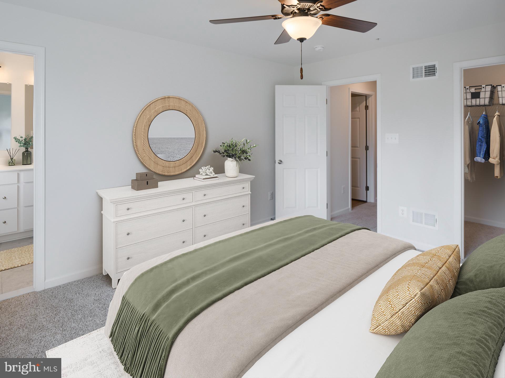 2603 Front Shed Drive Frederick, MD 21702 - Photo 5 of 77 a bedroom with a bed and a chandelier