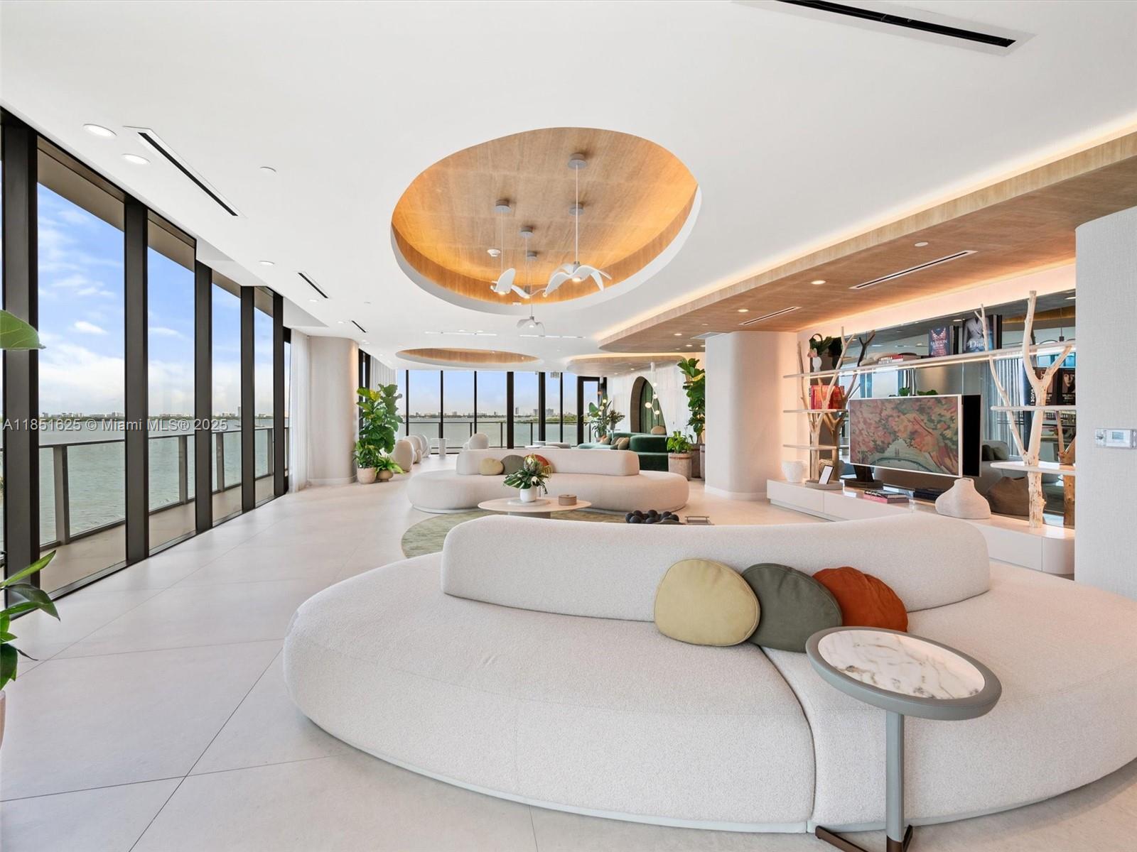 700 Northeast 24th Street, Unit 4305 Miami, FL 33137 - Photo 24 of 54 a living room with furniture and a table