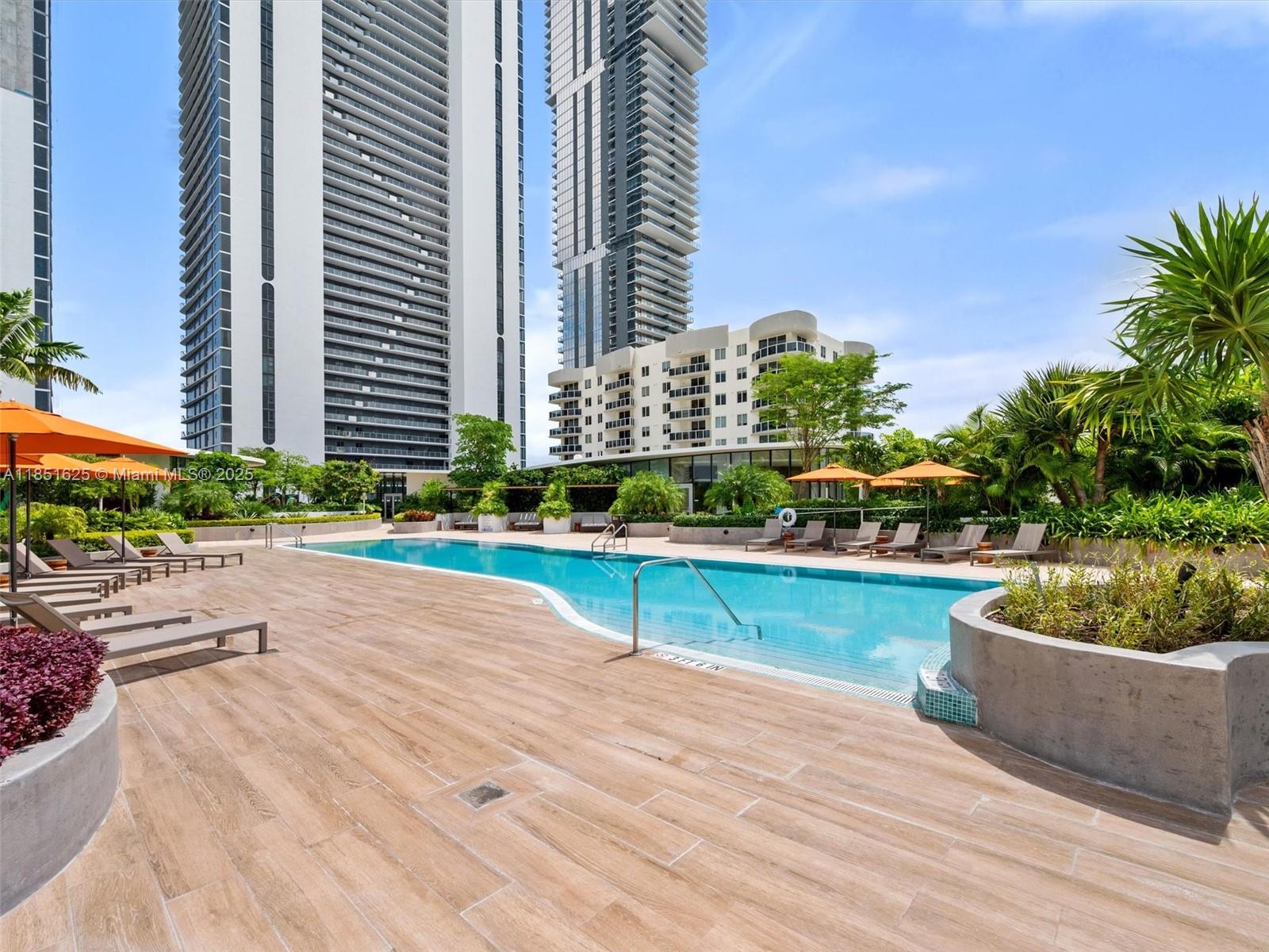 700 Northeast 24th Street, Unit 4305 Miami, FL 33137 - Photo 26 of 54 a view of a swimming pool with a patio