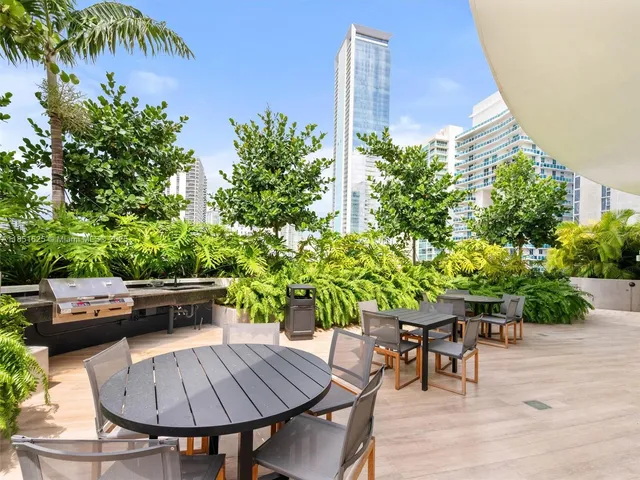 a dining room with window and tables