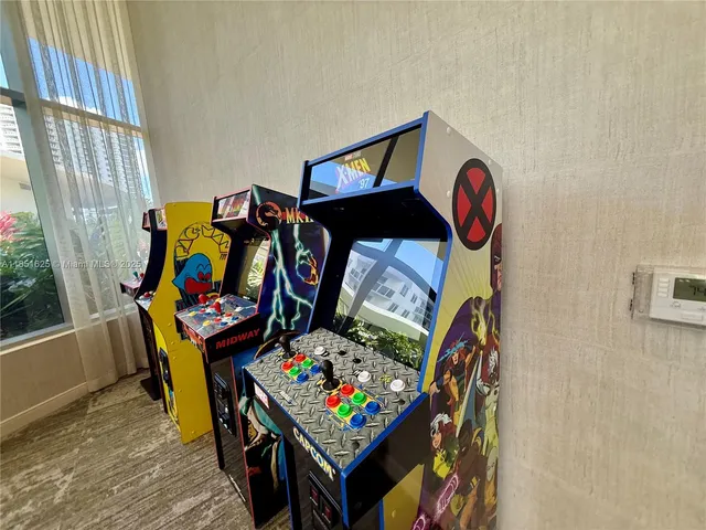 a room with gym equipment and a large window