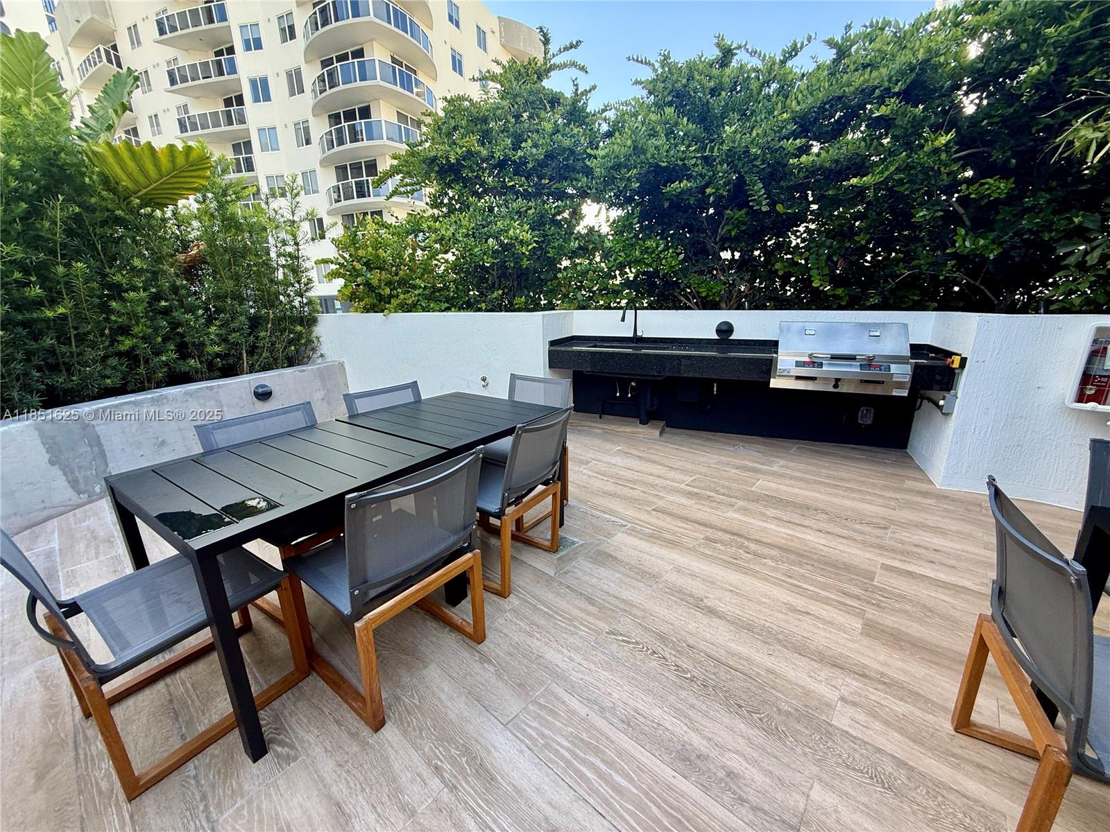 700 Northeast 24th Street, Unit 4305 Miami, FL 33137 - Photo 35 of 54 a view of a terrace with sitting area