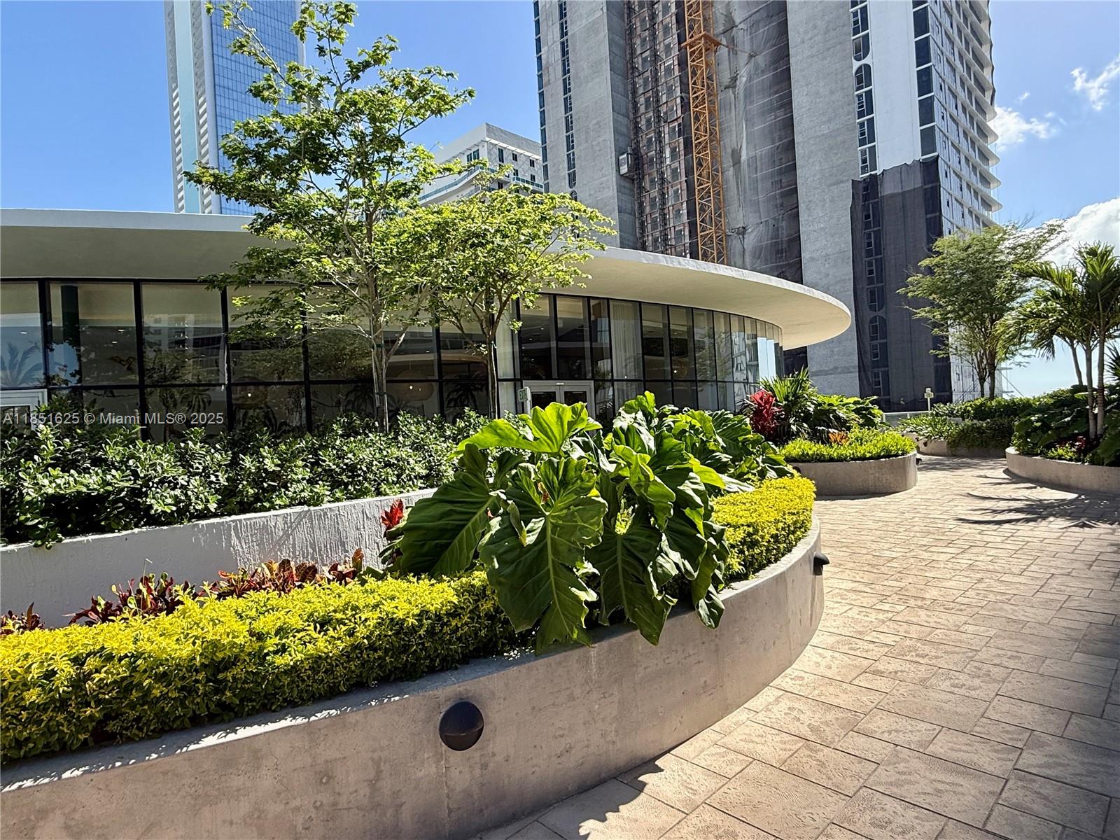 700 Northeast 24th Street, Unit 4305 Miami, FL 33137 - Photo 42 of 54 a view of a fountain with potted plants